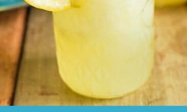 image of homemade honey lemonade with text overlay in blue that reads: homemade lemonade made with honey and fresh lemons