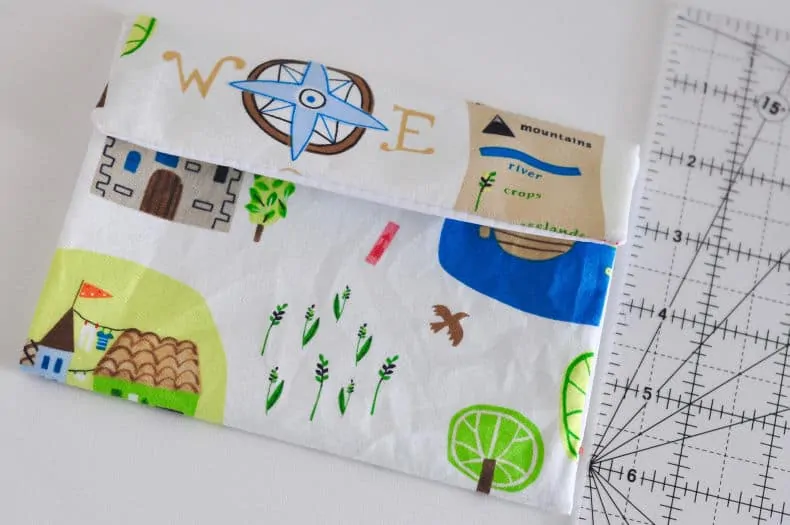 The top flap of the sewn rectangle is folded over the bottom flap to create an envelope type shape.