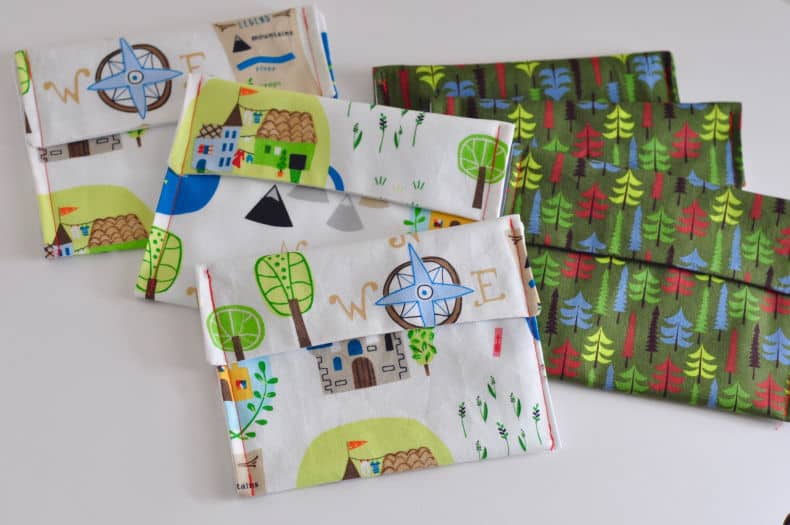 6 DIY snack bags in an adventure/woodland theme are laid out on a white surface.