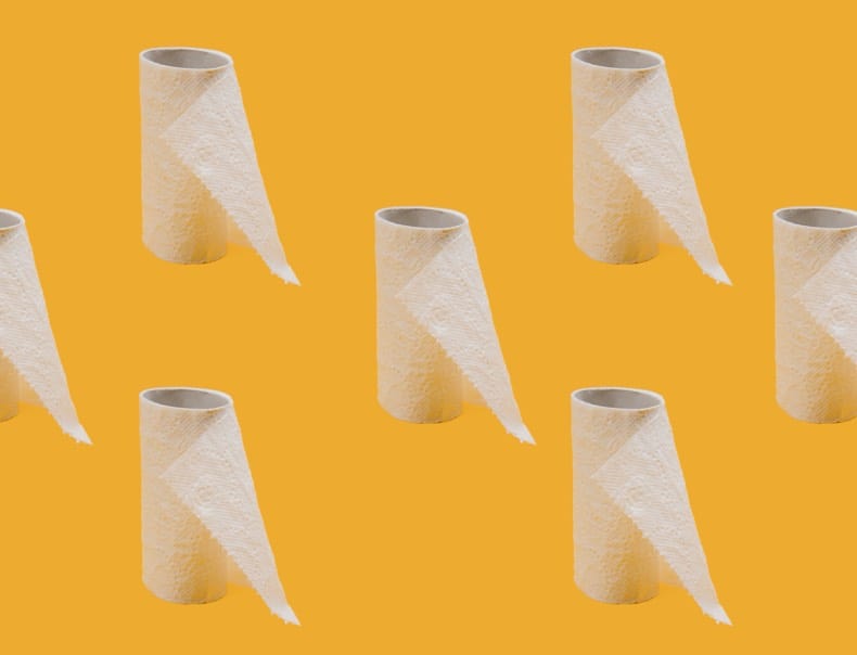 yellow background with rows of nearly-empty toilet paper rolls.